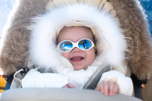 Baby in sunglasses in the winter